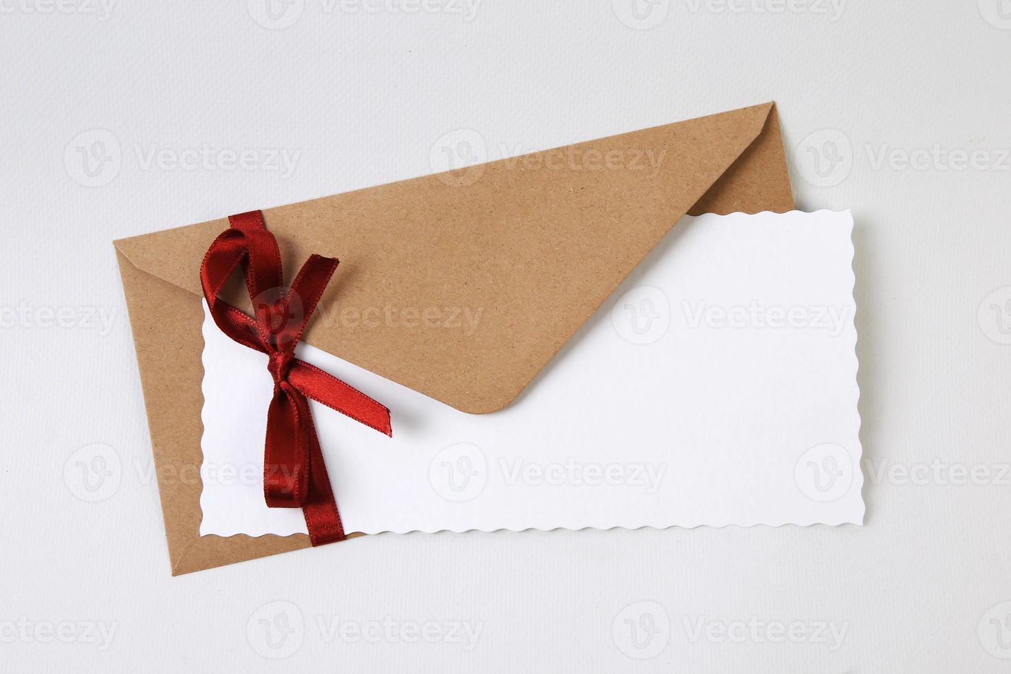 Brown envelope isolated on white background photo