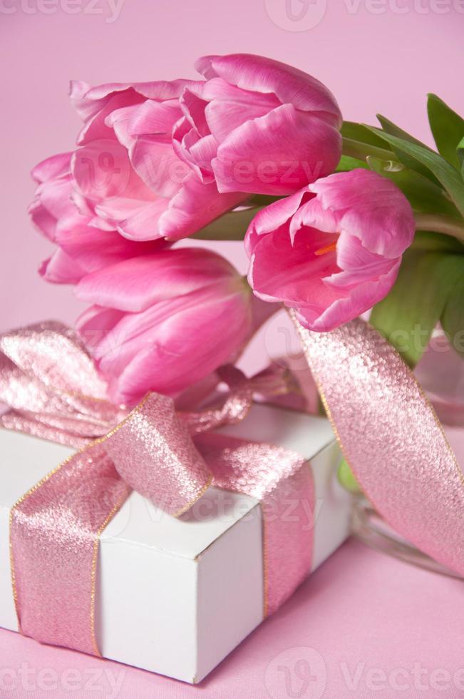 Pink tulips in vase with the gift box photo