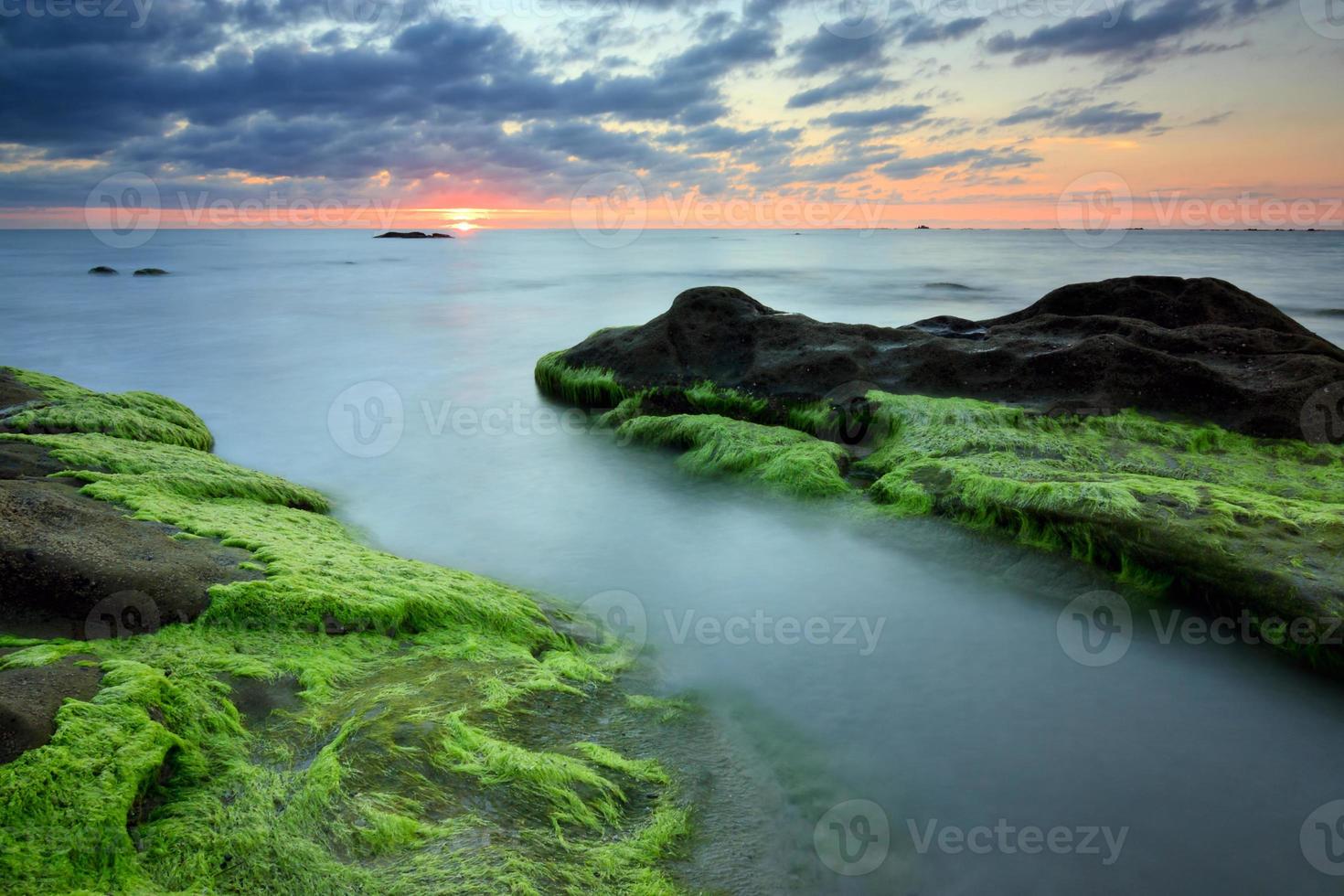 Rocks with green moss at sunset in Sabah, Borneo, Malaysia photo