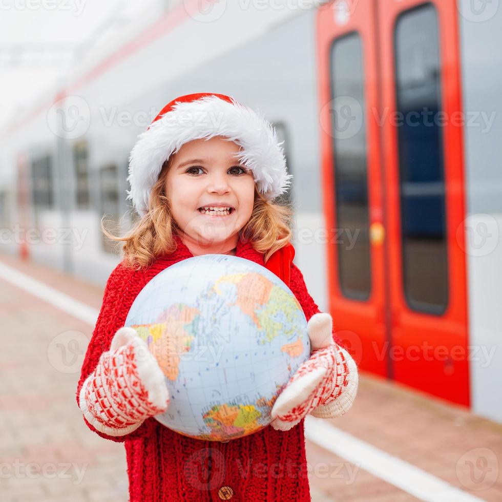 Little girl Santa traveling photo