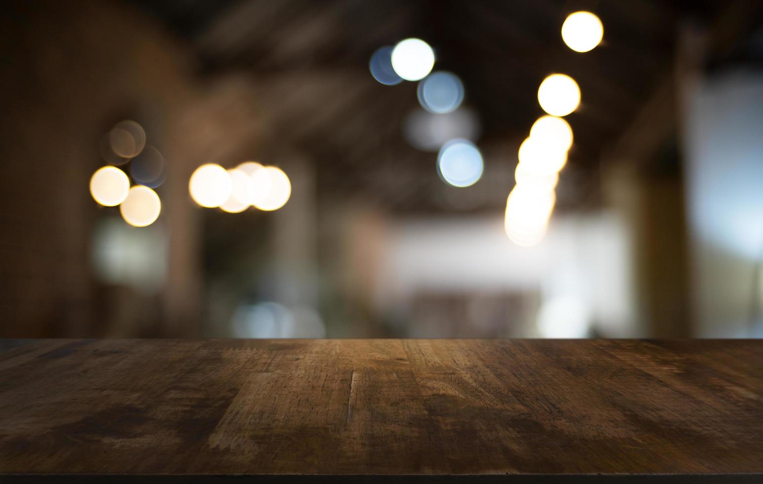 Wood table top with blurred background photo