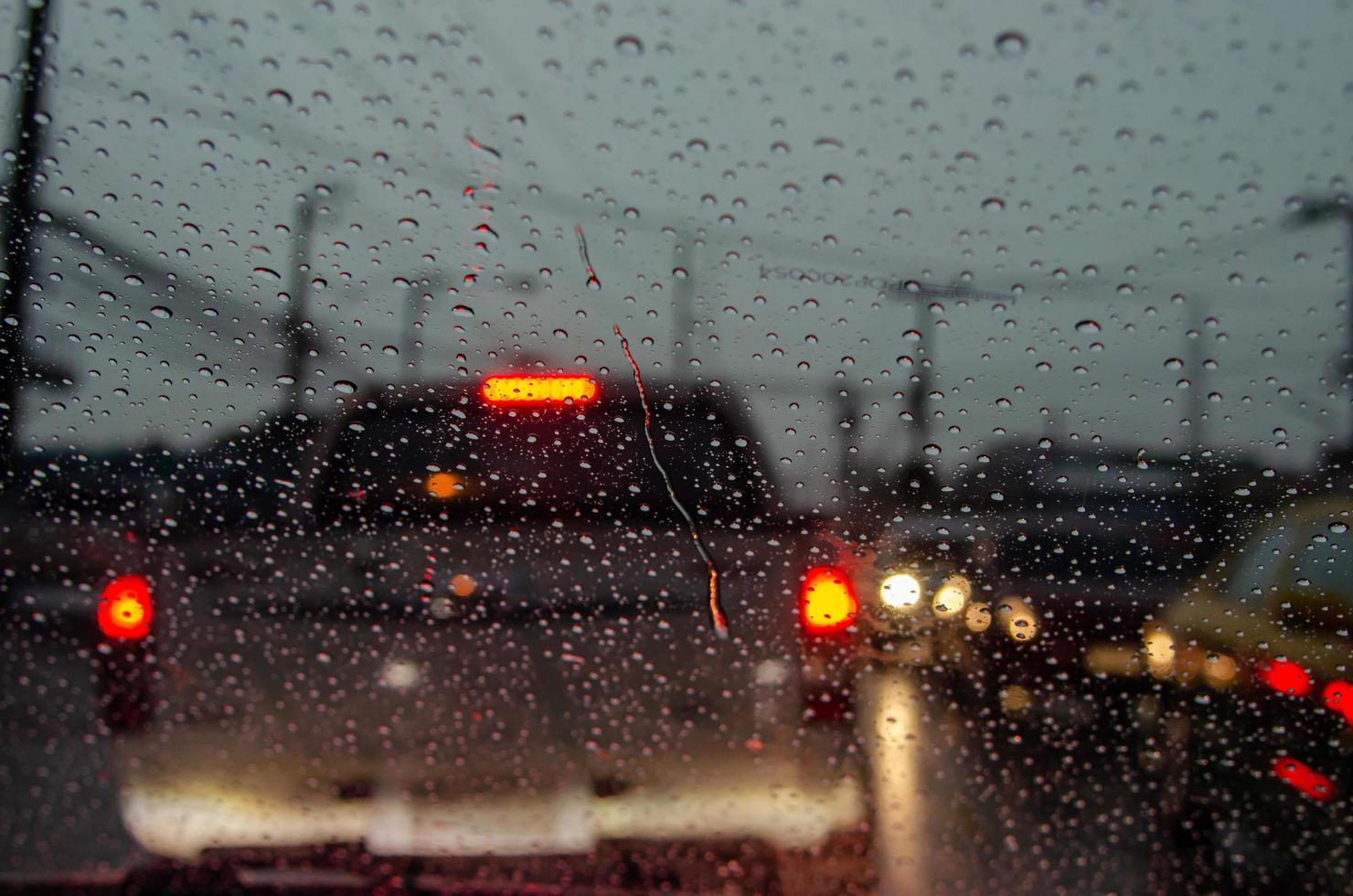Rain on car window in the evening photo