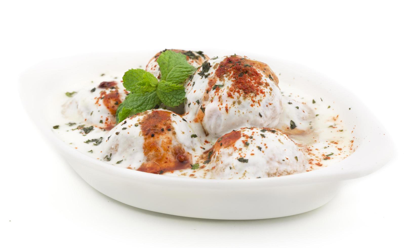 Dahi Vada, made of urad dal, rice, curd and other spices photo