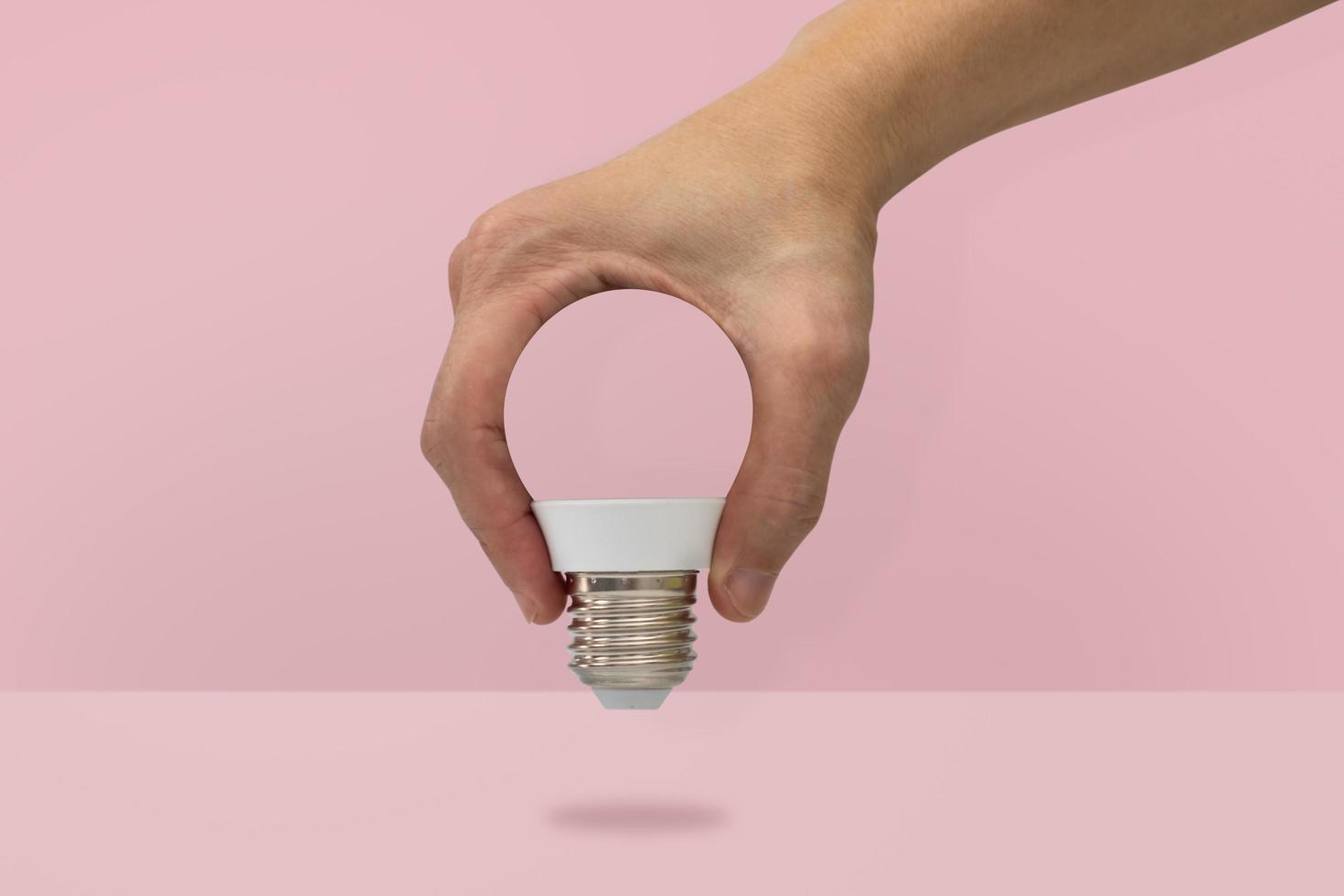 Hand holding a light bulb shape  photo