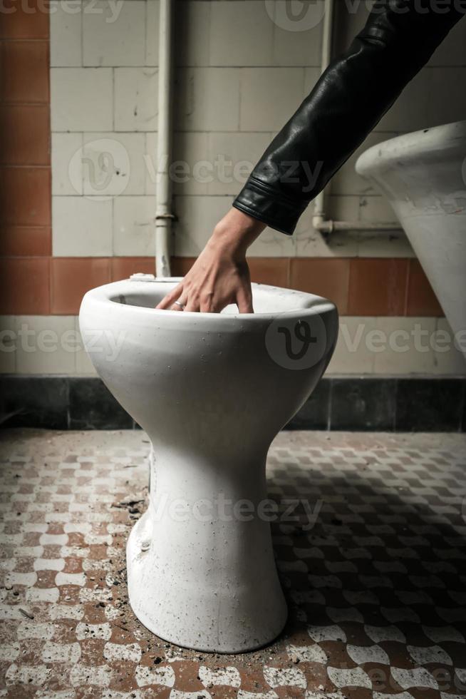 Hand in the toilet 1382083 Stock Photo at Vecteezy