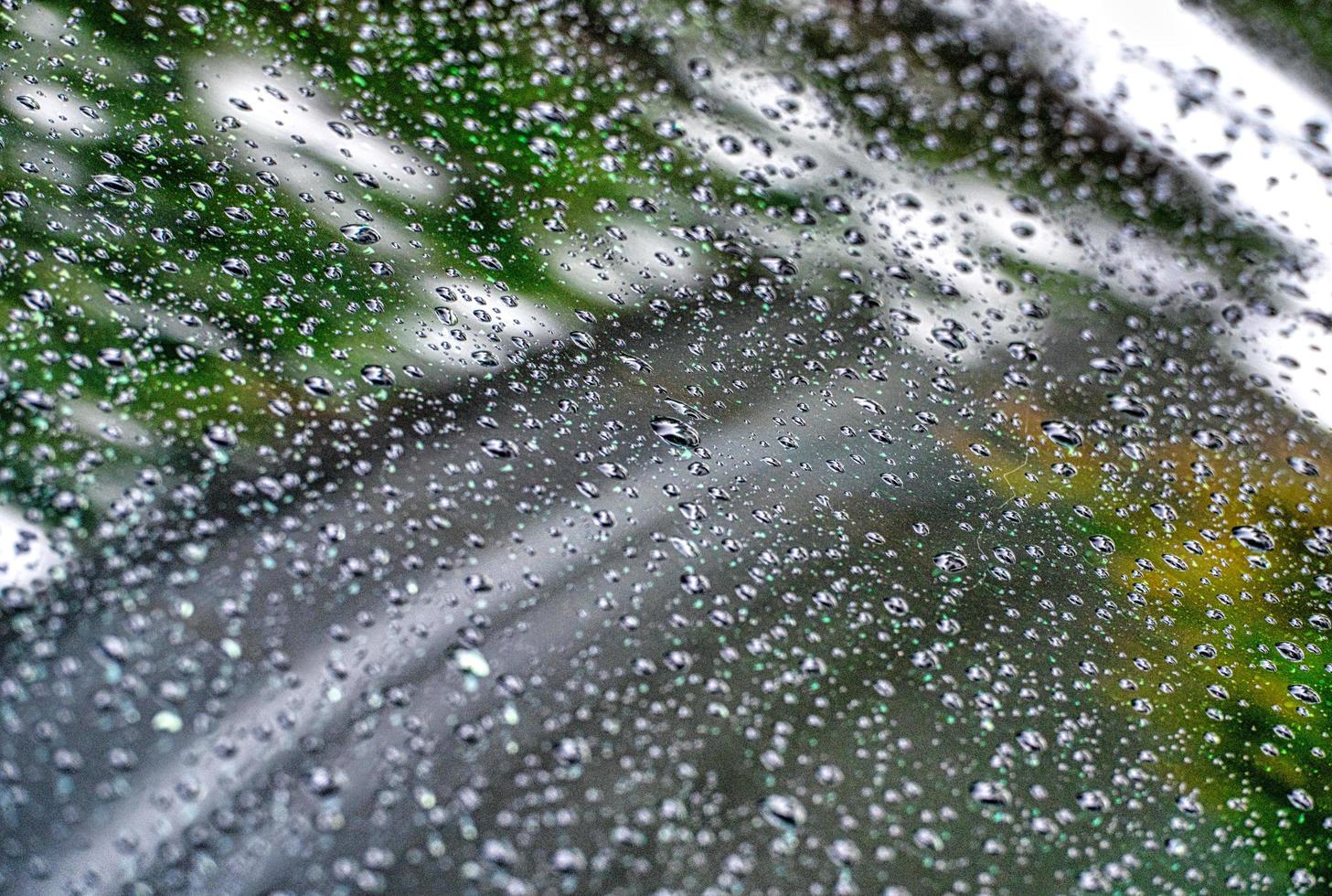 Water droplets on glass window photo