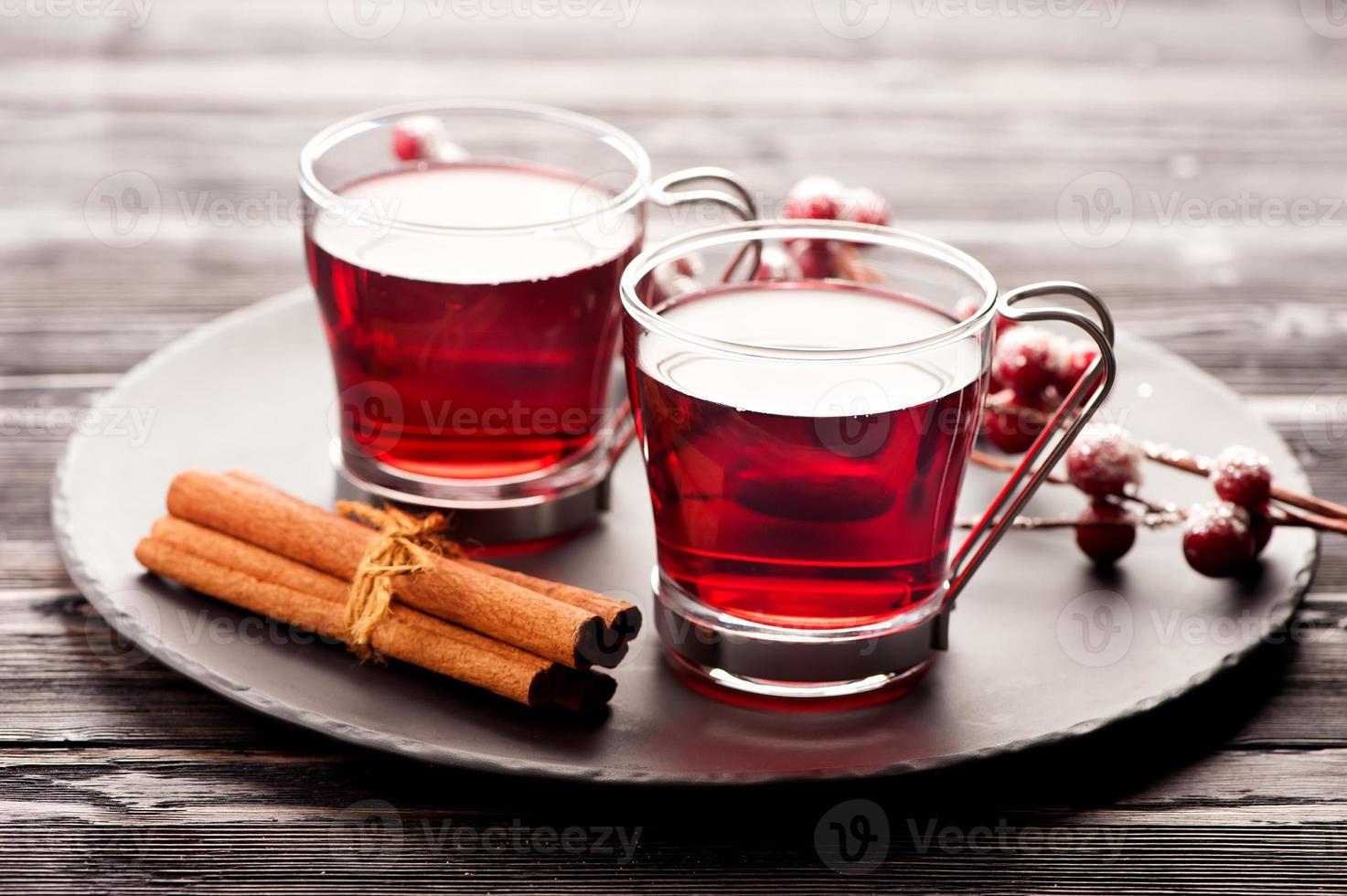 two glasses of red hot drink photo