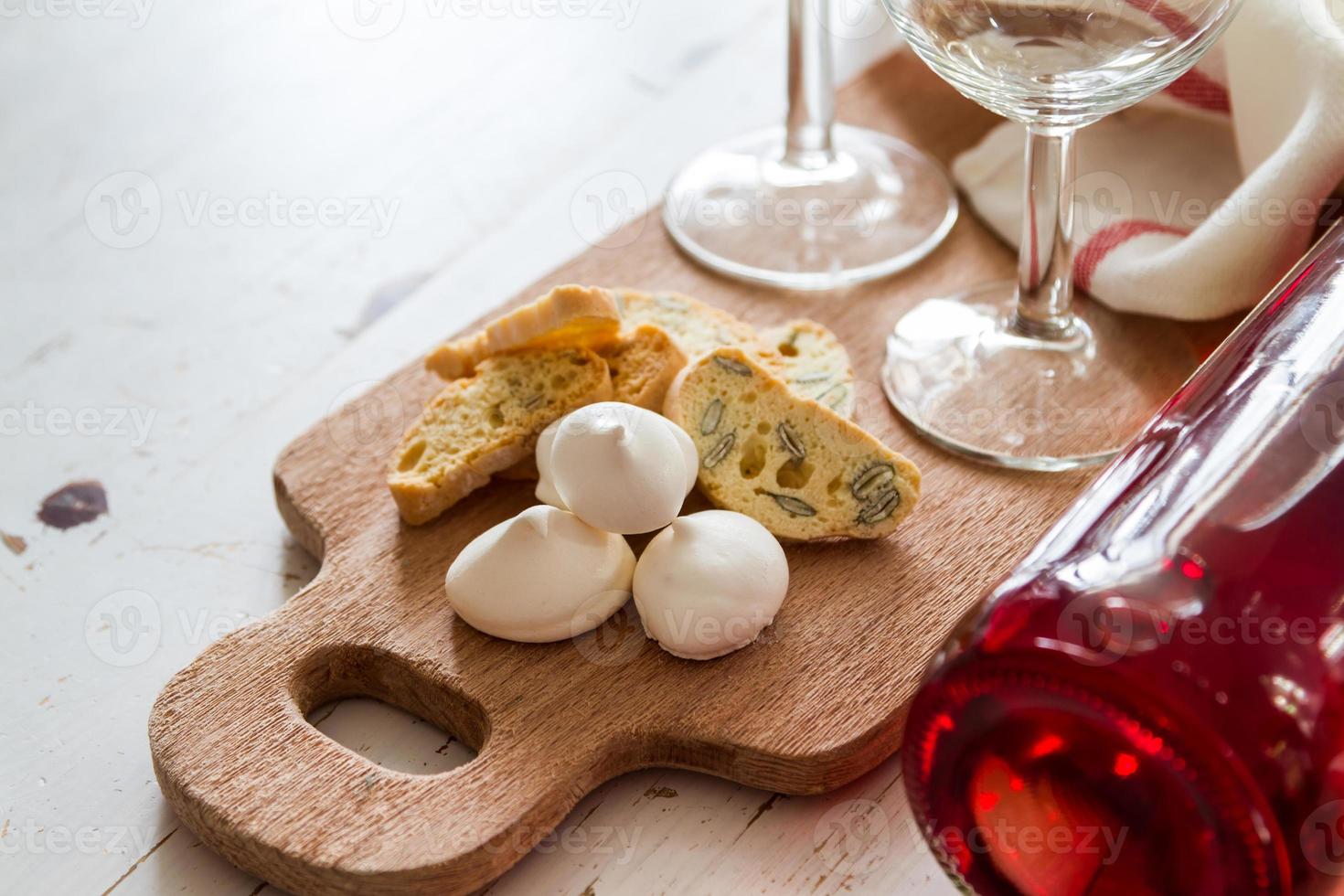 Traditional italian cookies served with wine photo