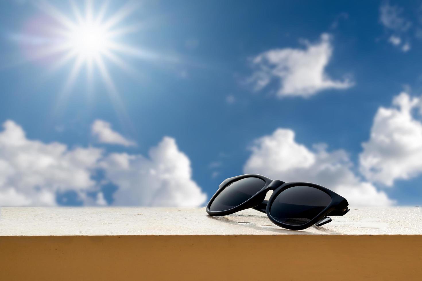 Black sunglasses on a ledge photo