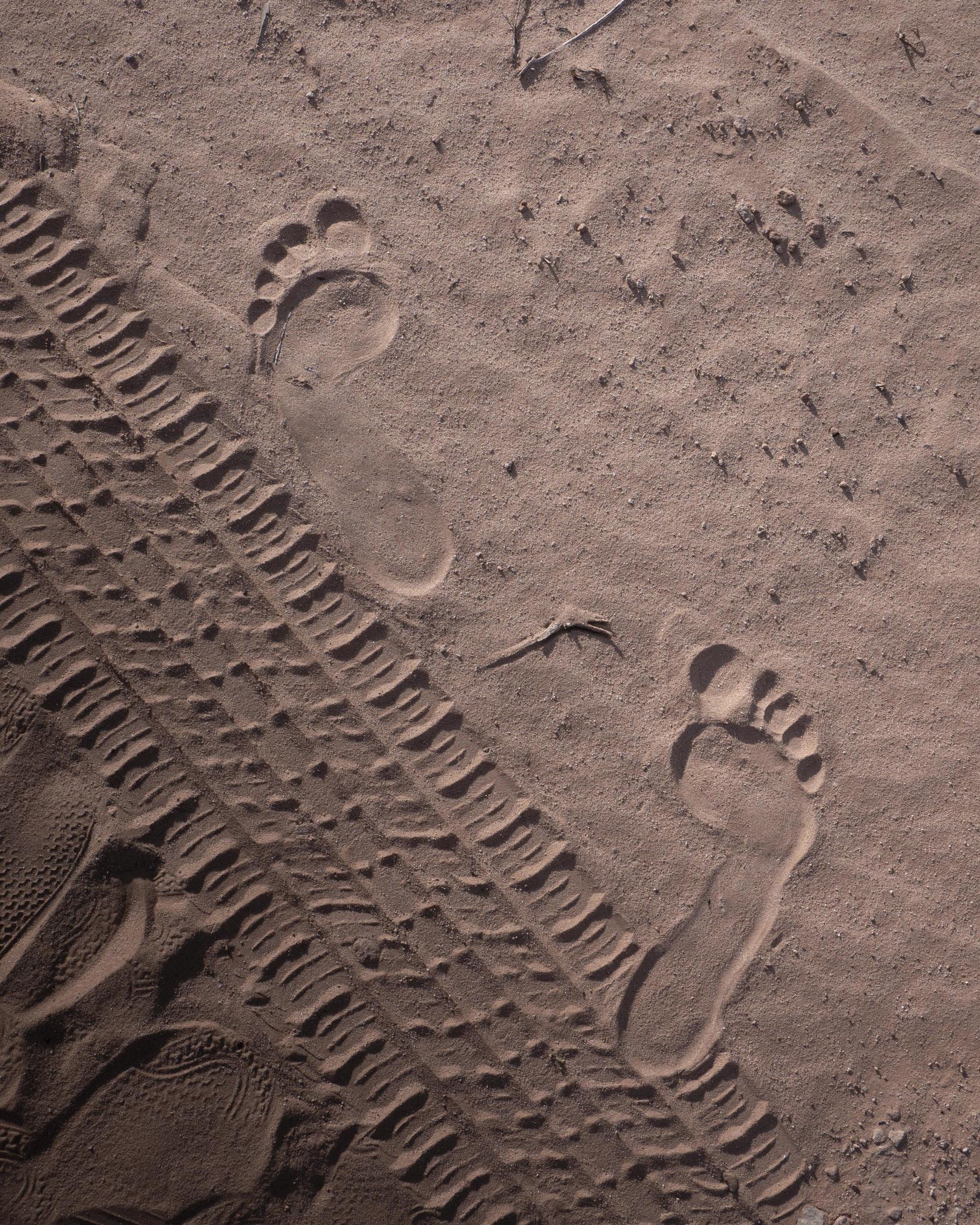 Foot prints in the sand 1397020 Stock Photo at Vecteezy