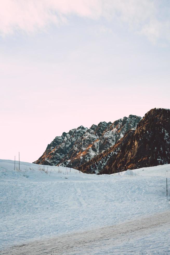 Snow covered field under white sky during daytime photo