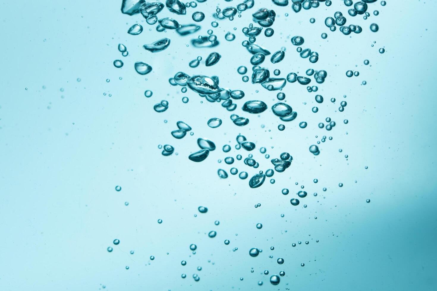 Bubbles in blue water background photo