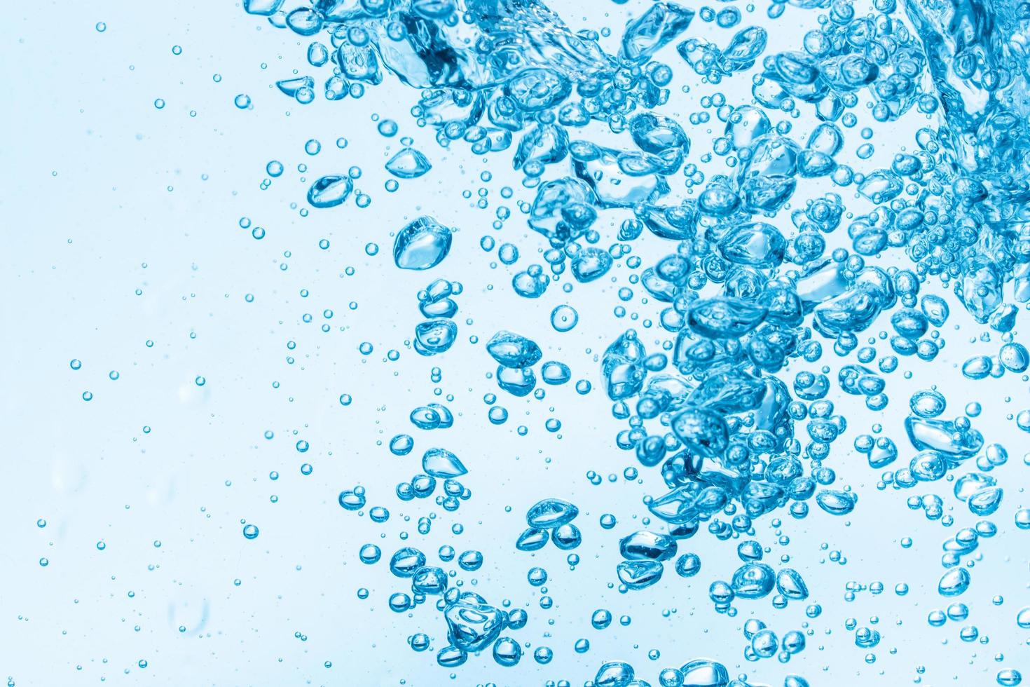 Bubbles in blue water background photo