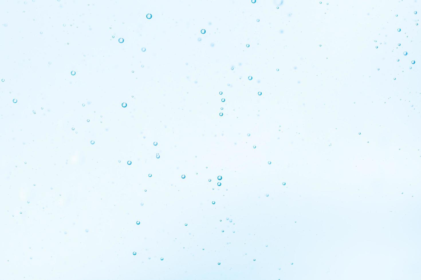 Bubbles in blue water background photo