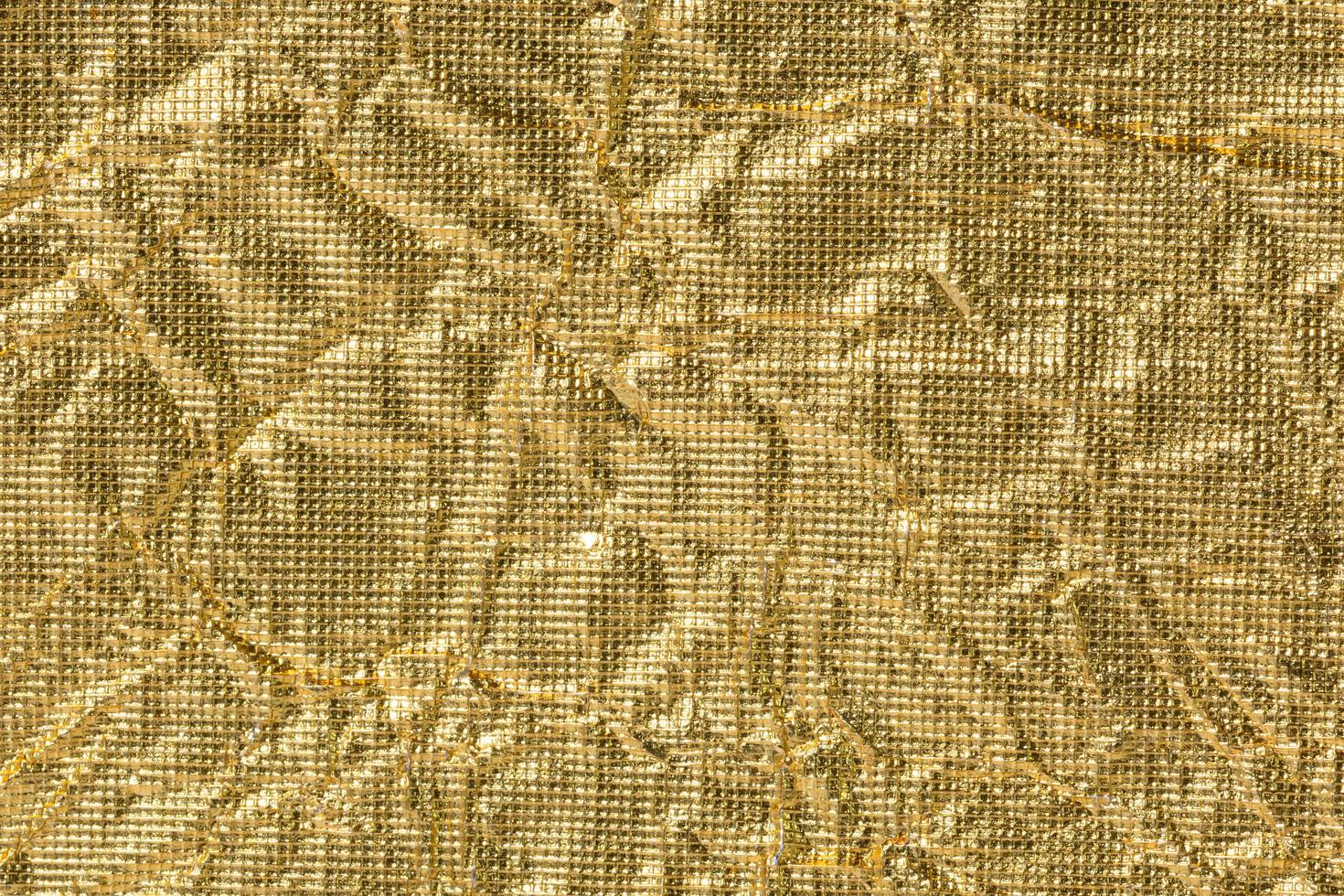 Wrinkled golden paper background photo
