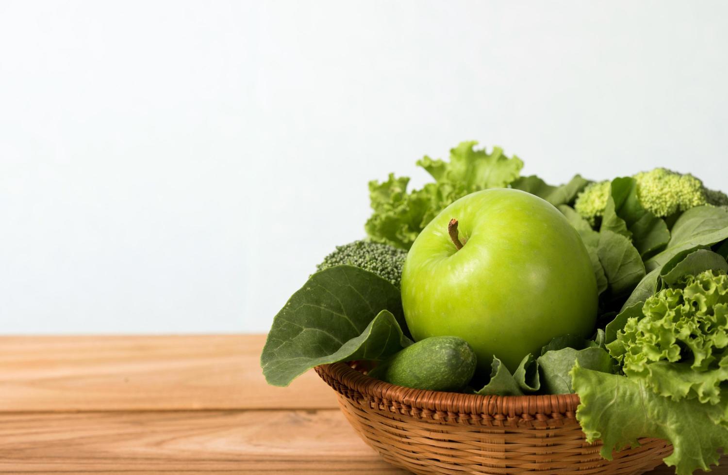 Close up of green apple with mixed green vegetables photo