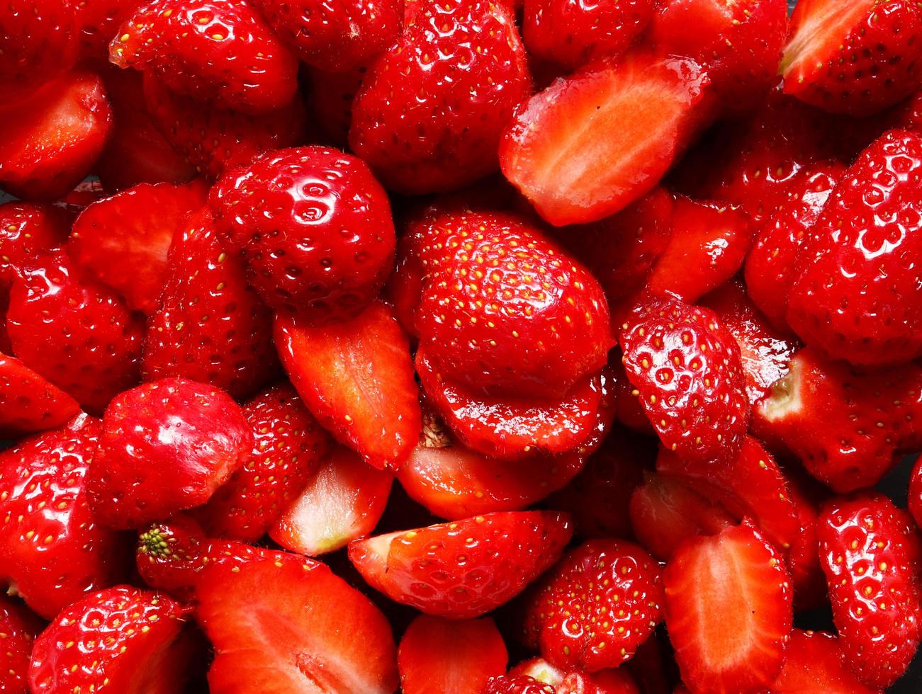 Cut strawberries background photo