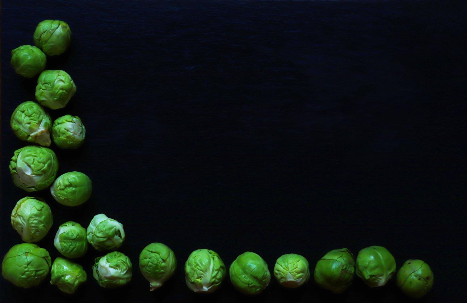 Brussels sprouts on slate background photo