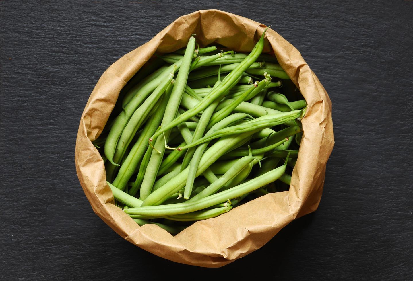 Green beans in a brown paper bag photo