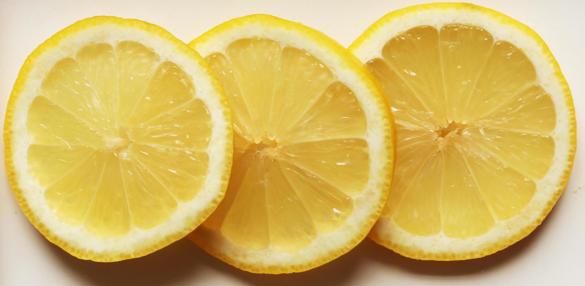 Three isolated lemon slices photo