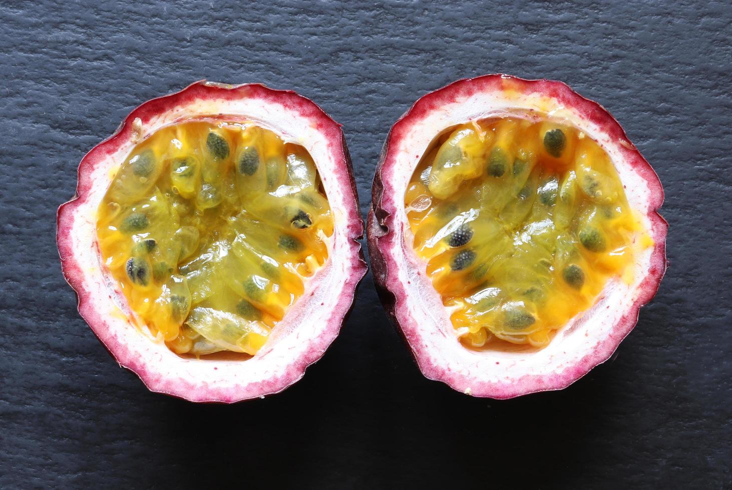 A passion fruit cut in half 1410357 Stock Photo at Vecteezy