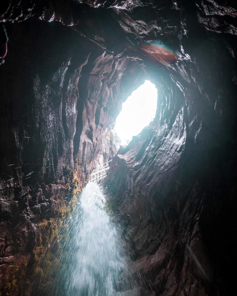 Water flowing inside a cave photo