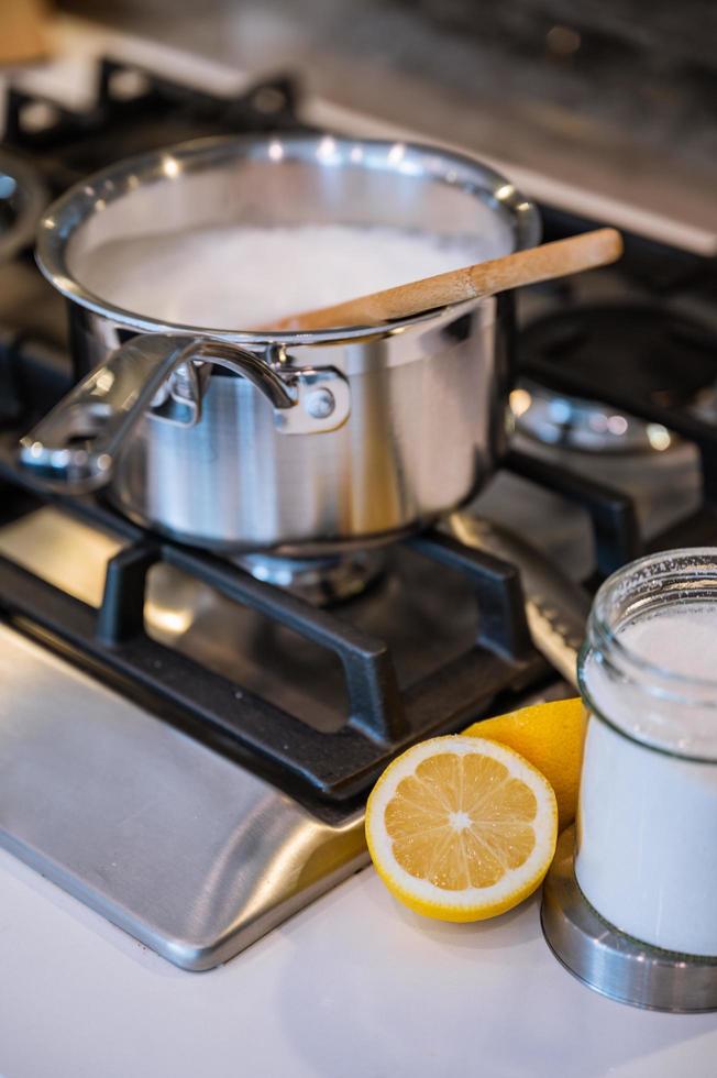 Lemons next to a pot photo