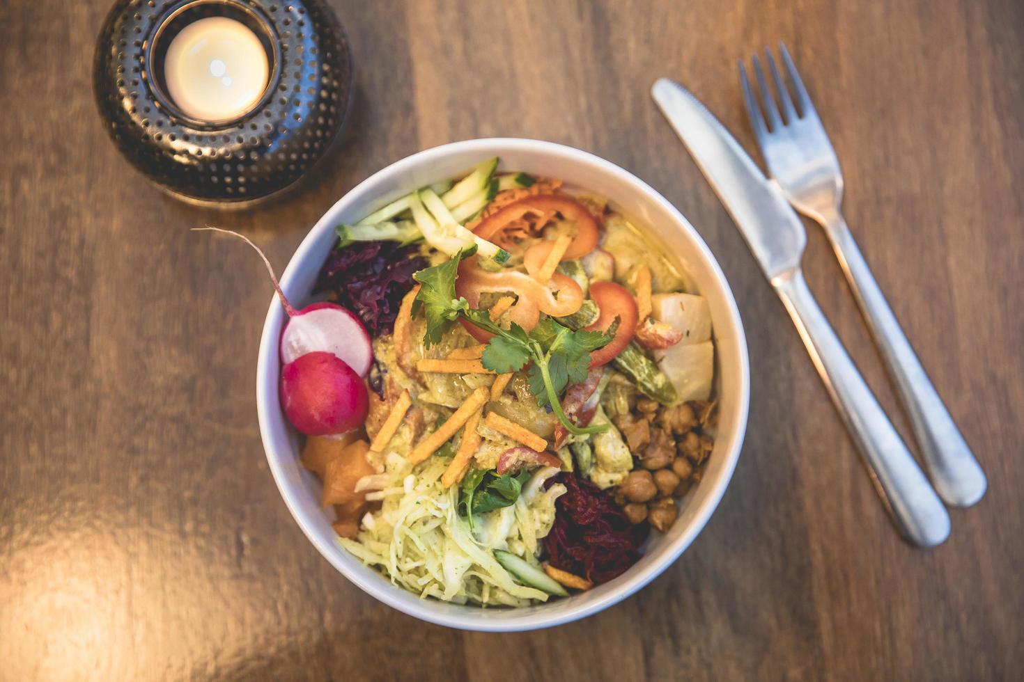 Flat lay view of tasty vegetarian salad photo