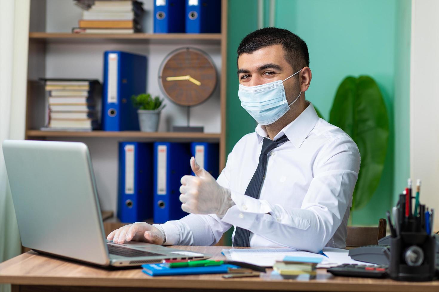 Wearing protective mask at work photo