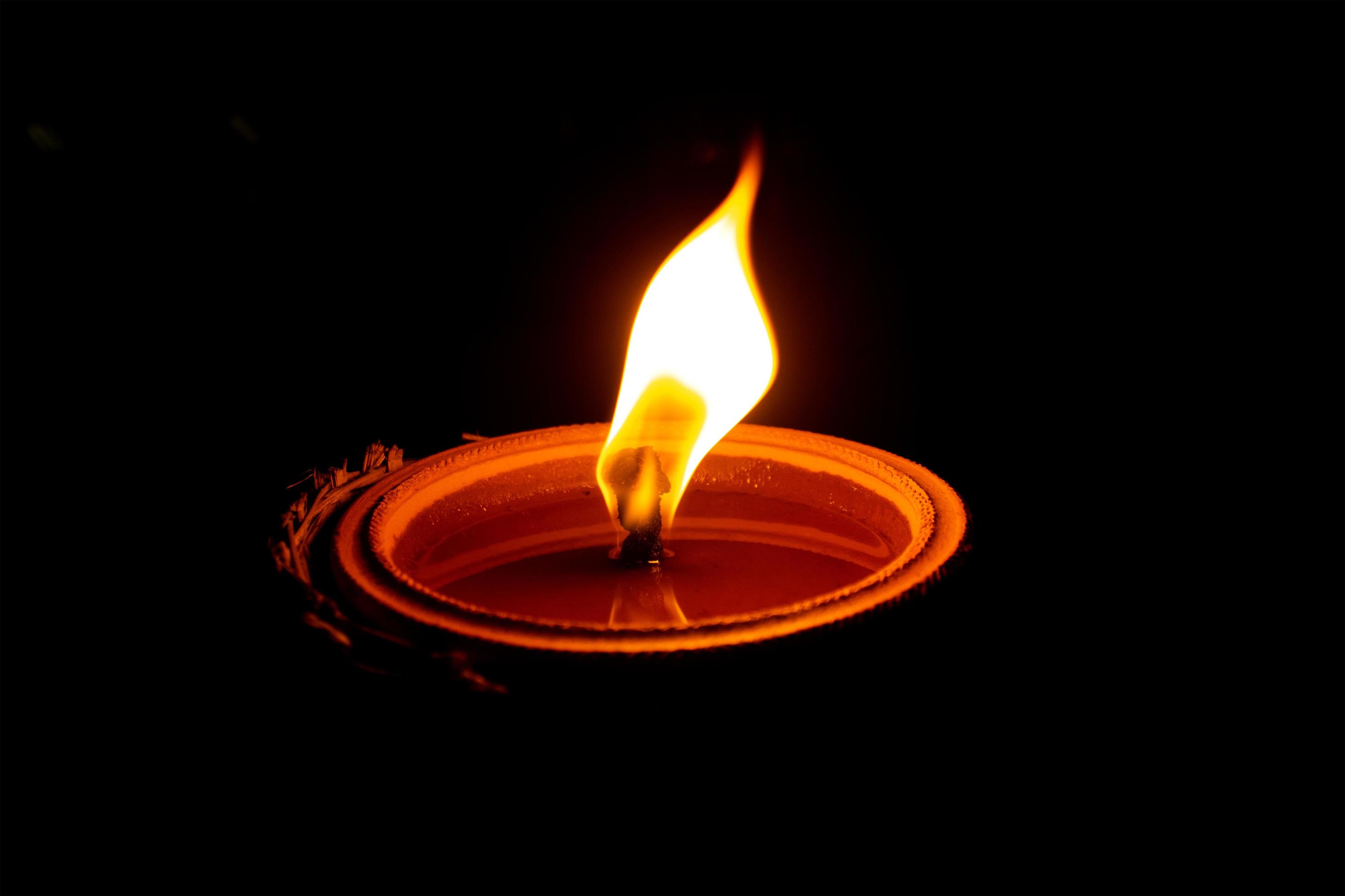Candle flame on black background 1416230 Stock Photo at Vecteezy