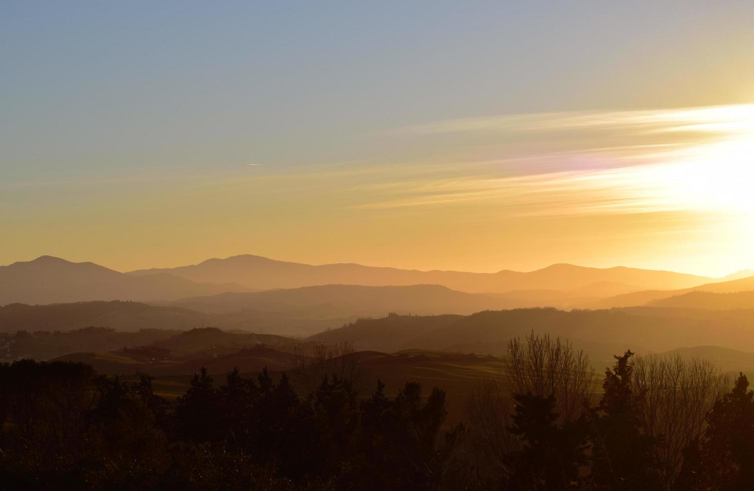 Silhouette of mountain during golden hour photo