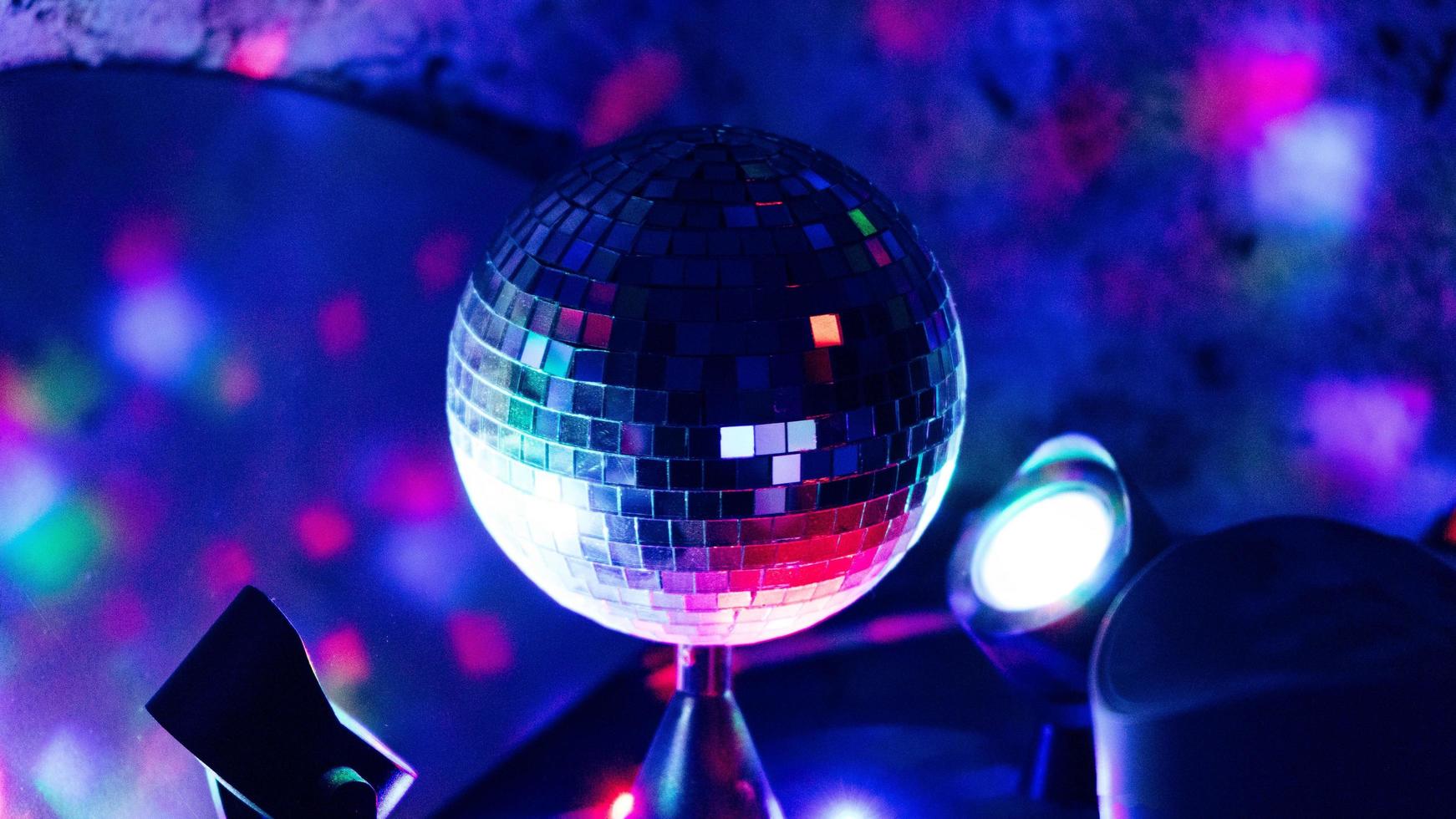 Disco ball under neon lights photo