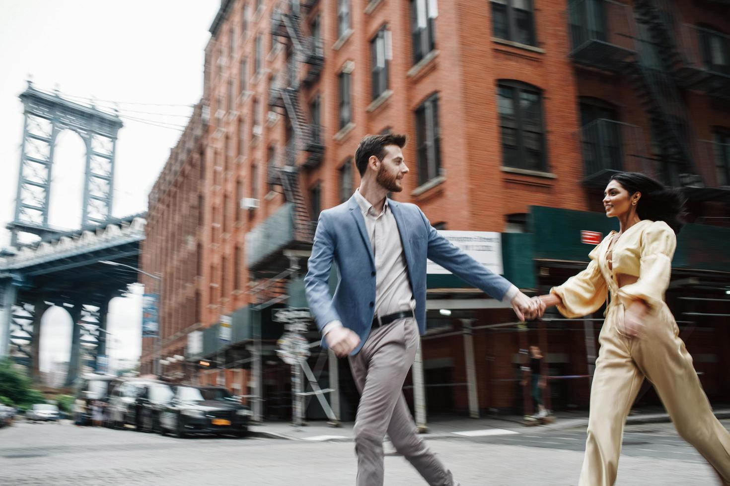 Attractive couple embraces in the city photo