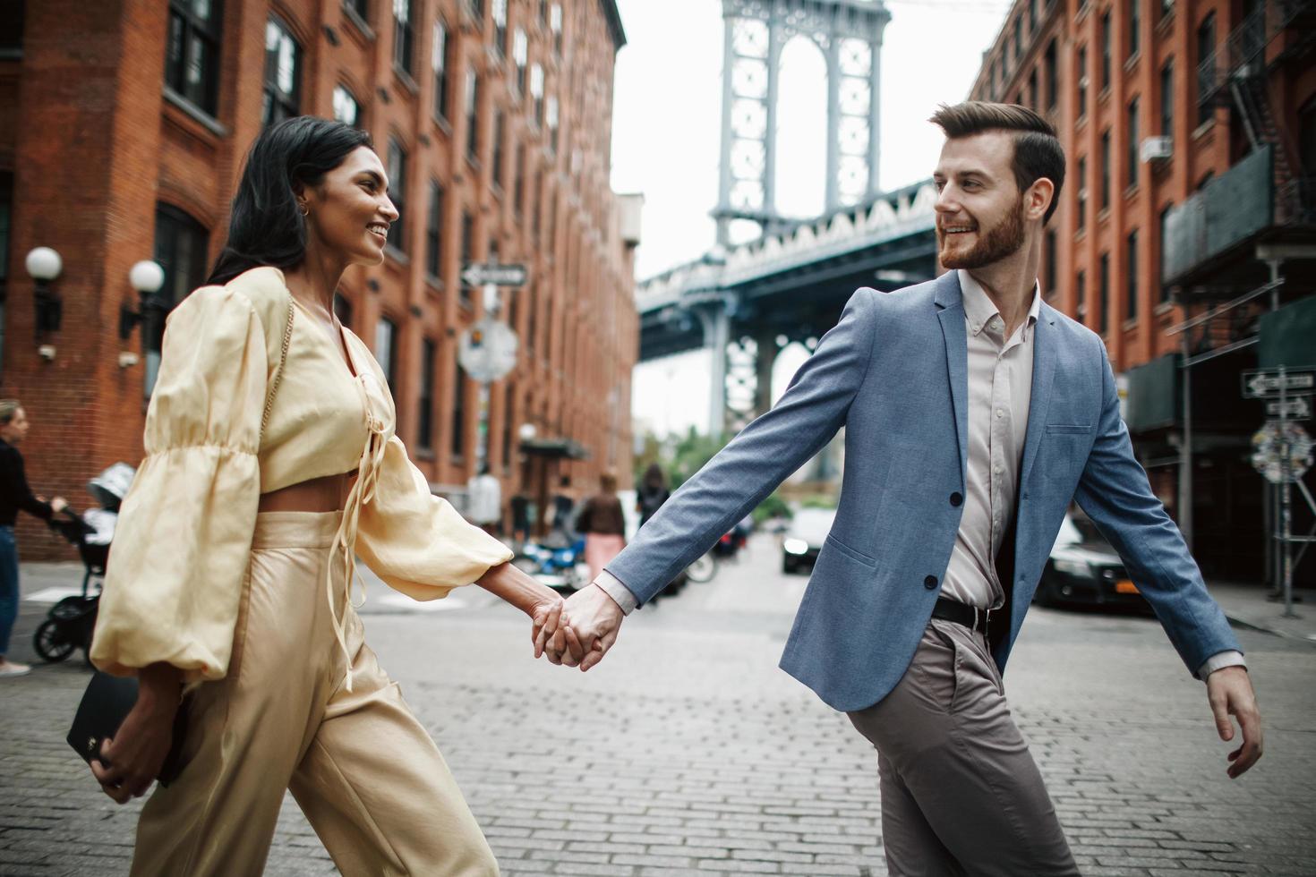 Attractive couple embraces in the city photo