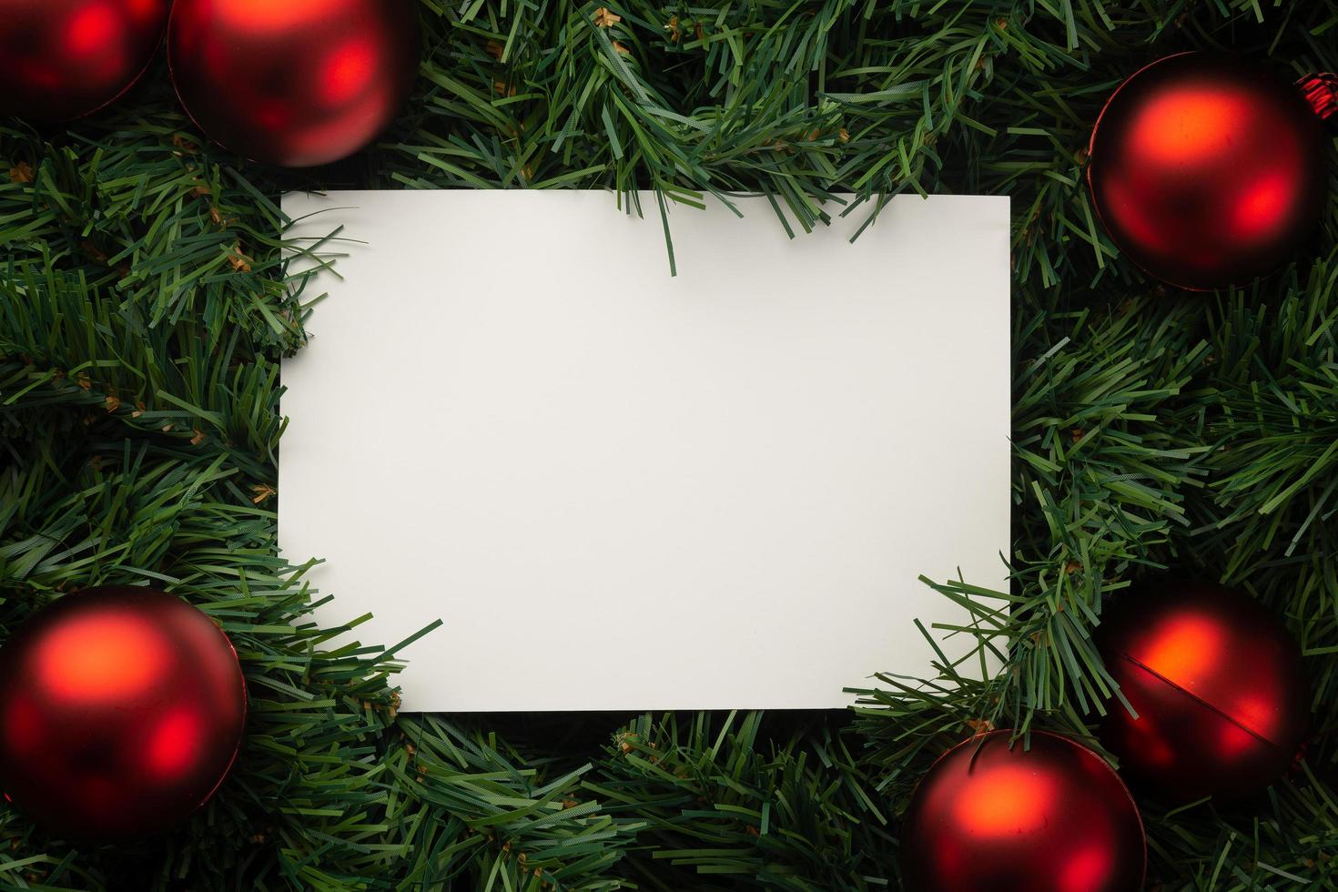 Paper surrounded by Christmas decor photo