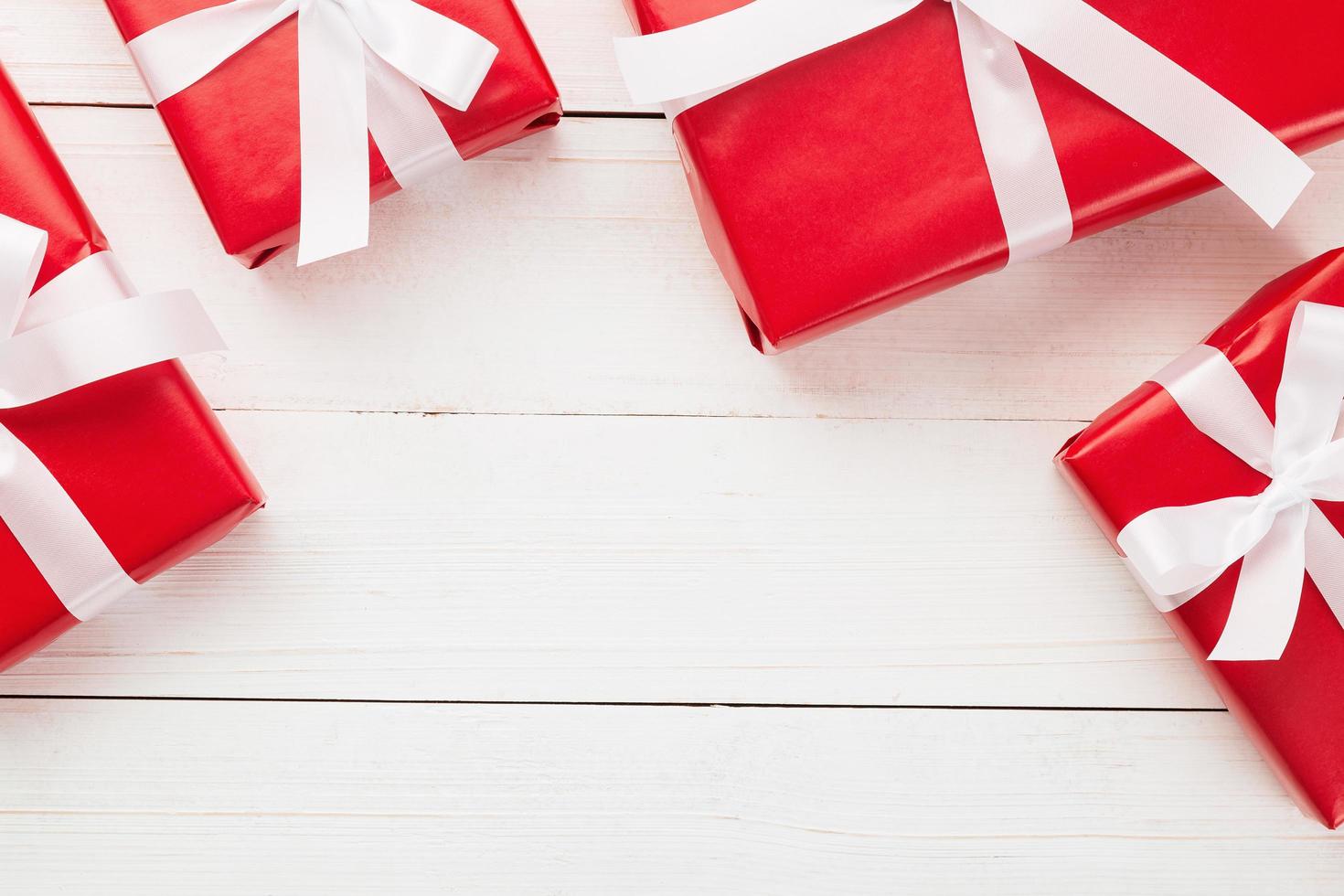 Gift boxes on white wooden table photo