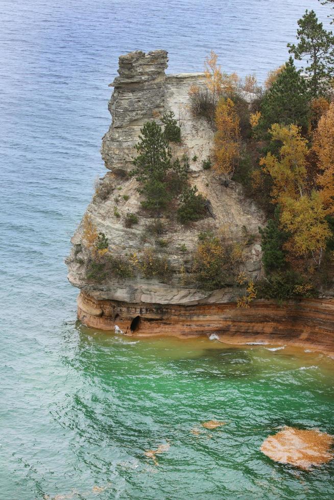 Blue water and a cliff photo