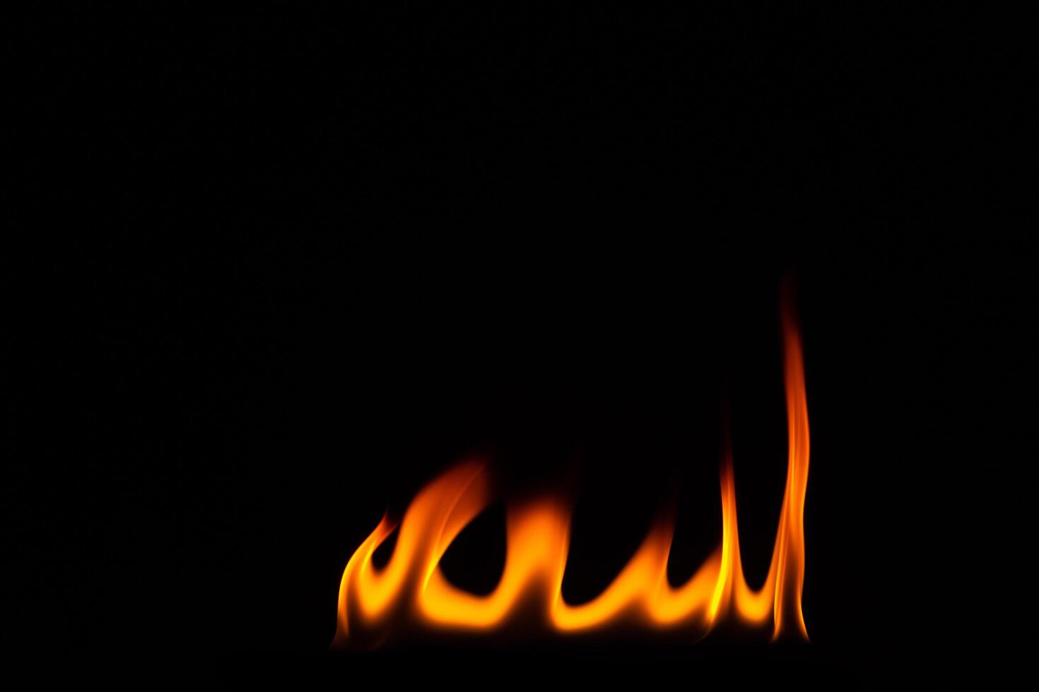 Flames over black background photo