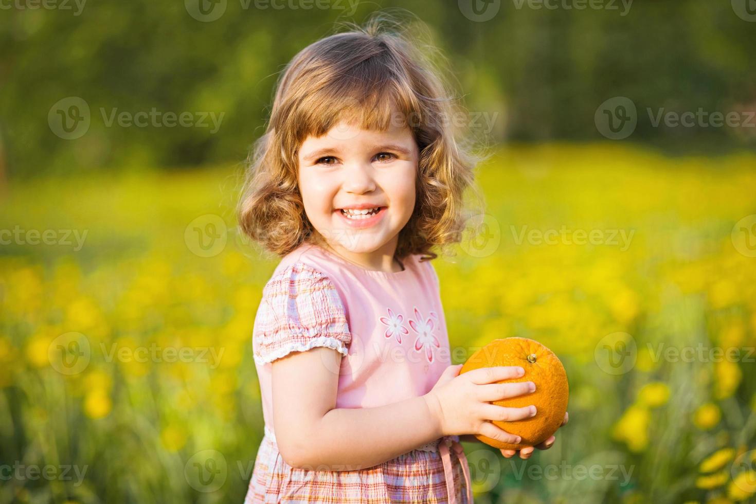 Cute child with an orange photo
