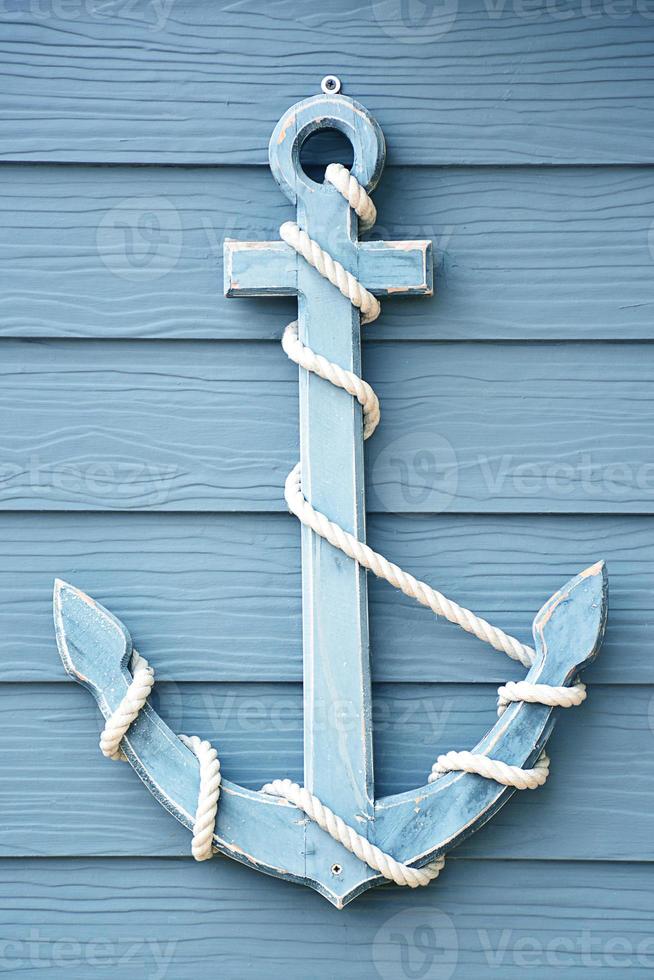 Anchor on blue wooden. photo