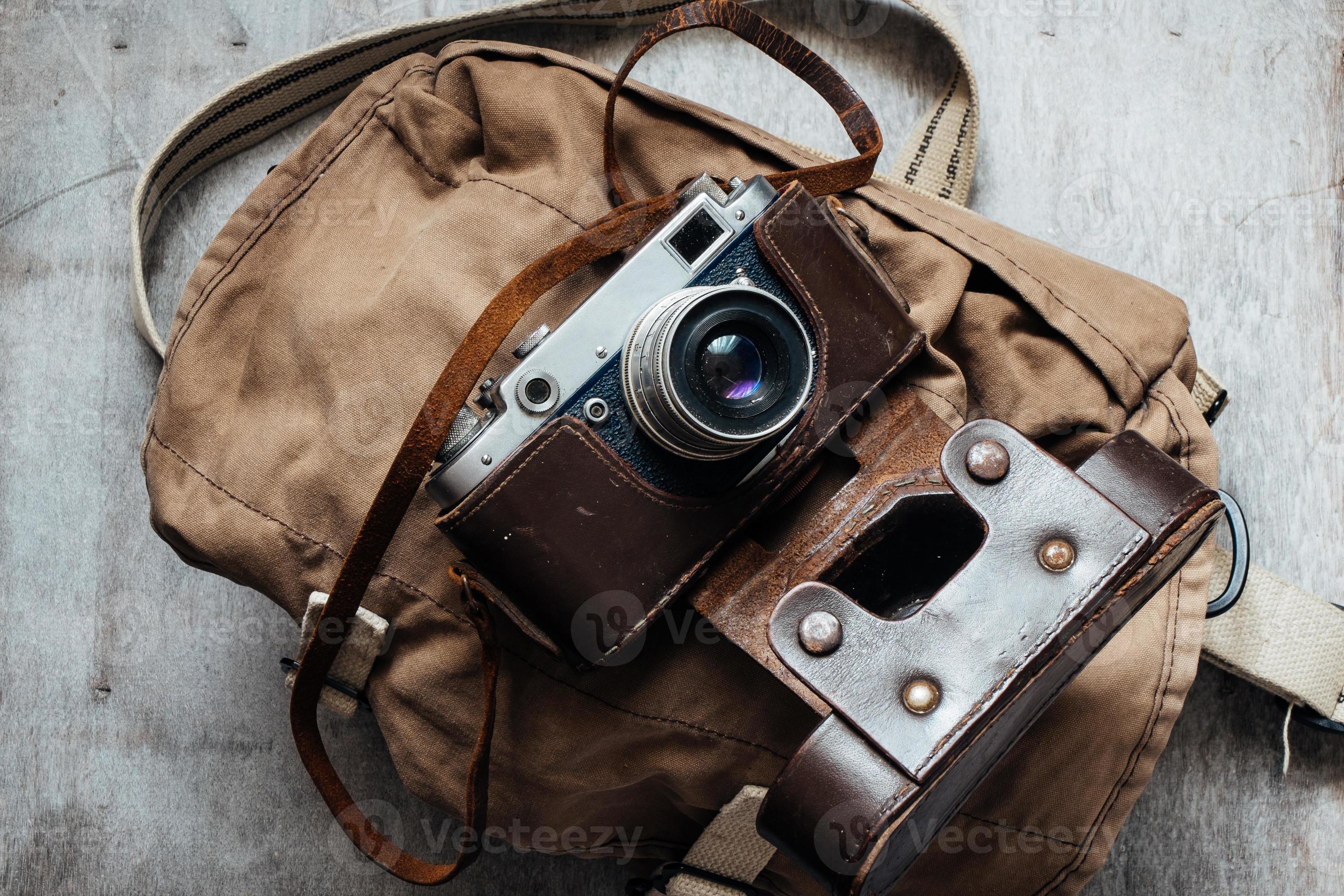Old camera in bag, vintage photo grunge design component 1423227 Stock