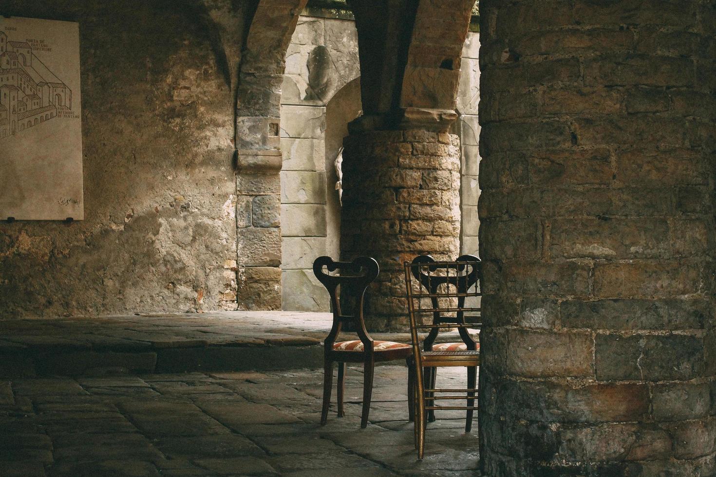 London, England, 2020 - Wooden chairs in a crypt photo