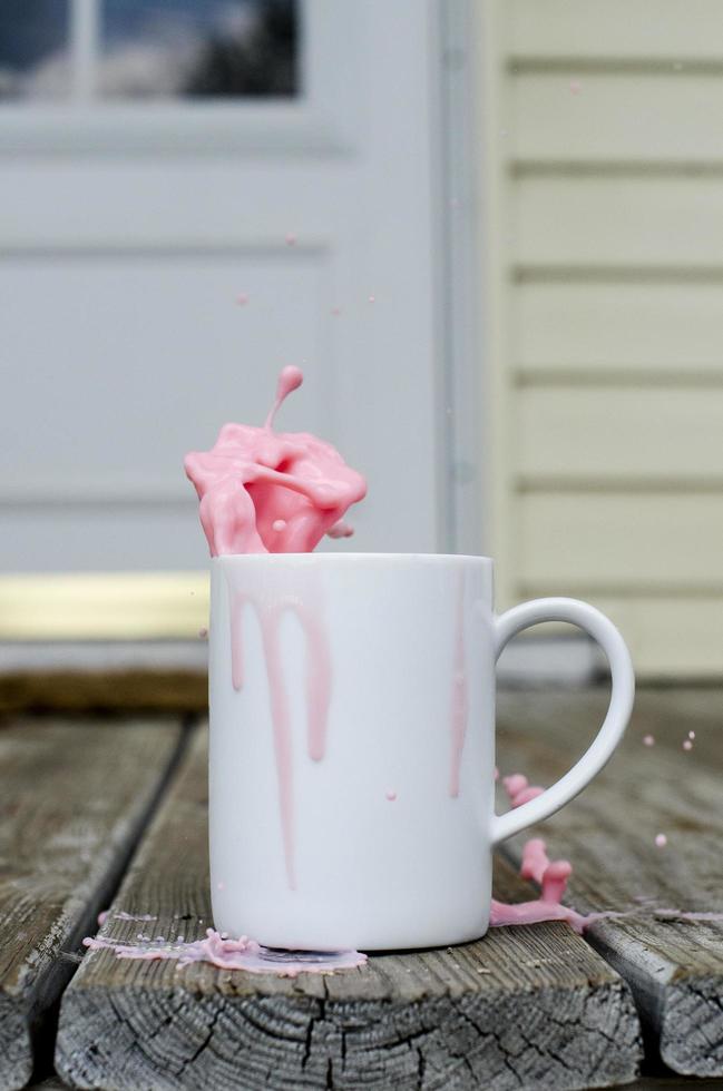 Pink milk spilling photo