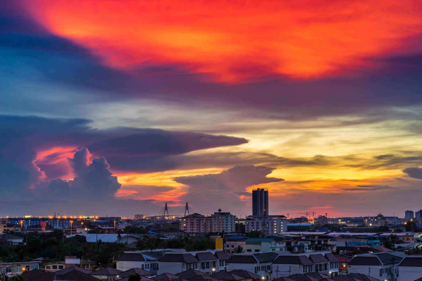 Cityscape and beautiful cloudy sky in the evening photo