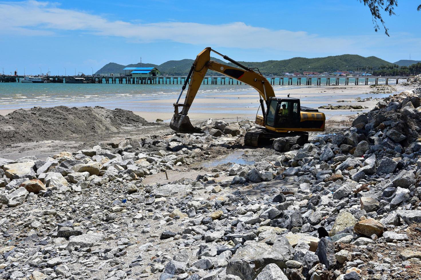 Man operating crawler excavator photo