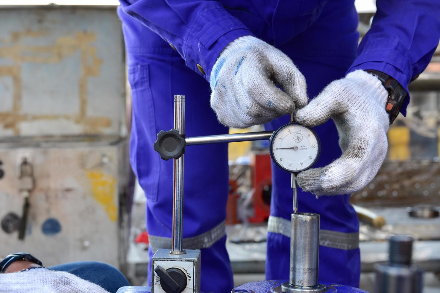 Technician using a dial gauge photo