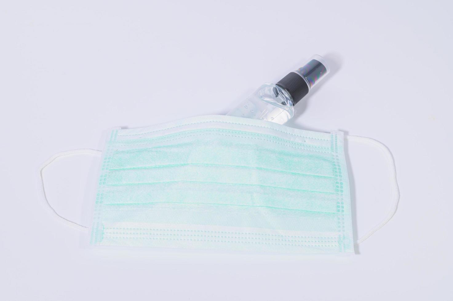 Sanitary mask with alcohol gel photo