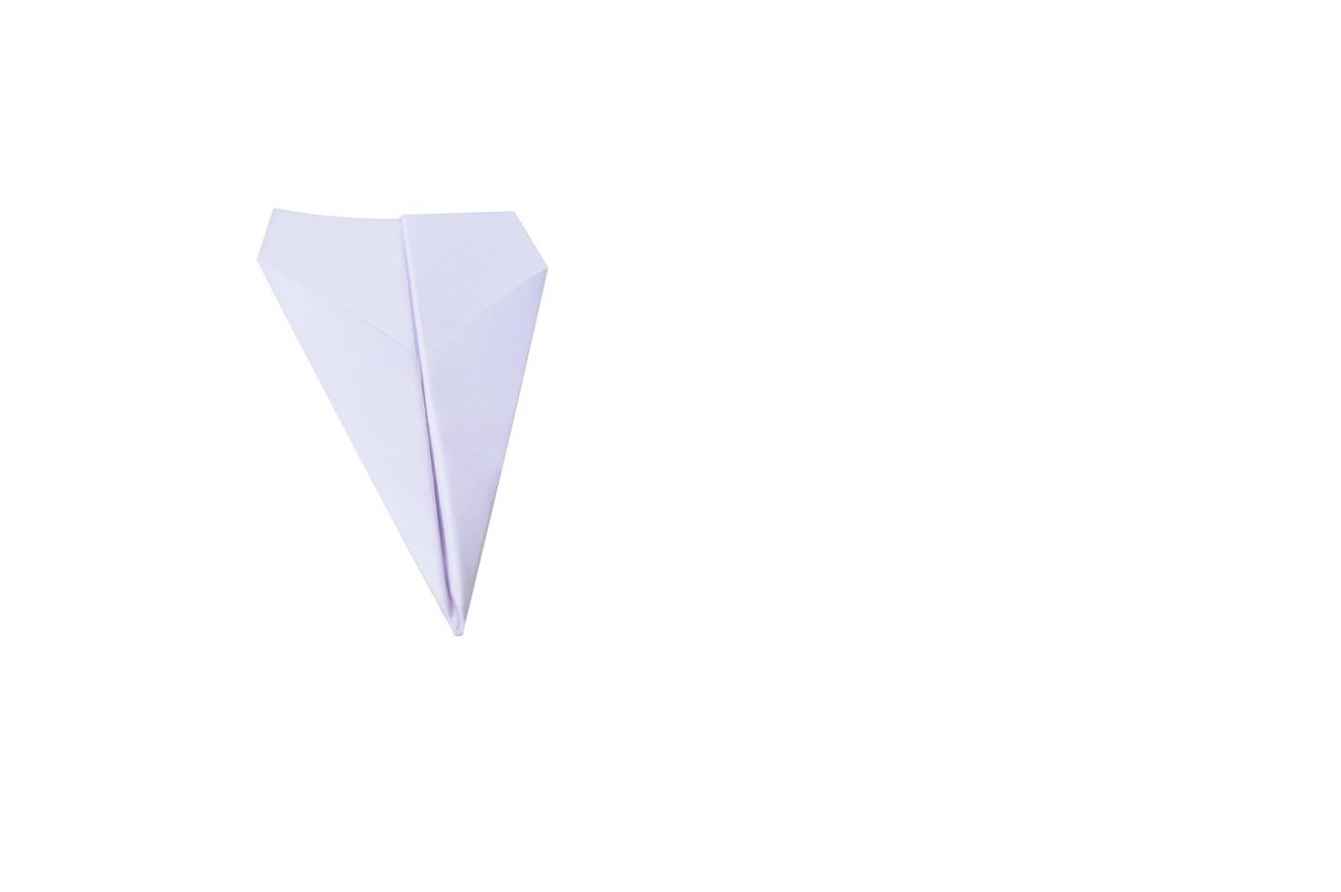 Folding paper plane on white background photo