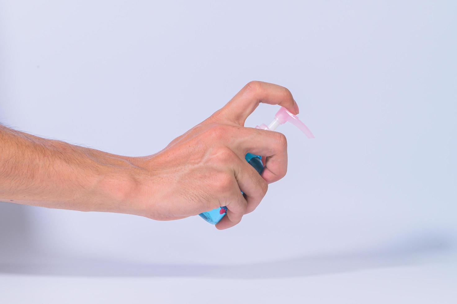 Cleaning hands with alcohol gel photo