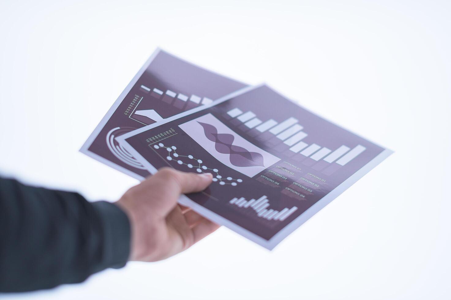 Hand holding documents photo